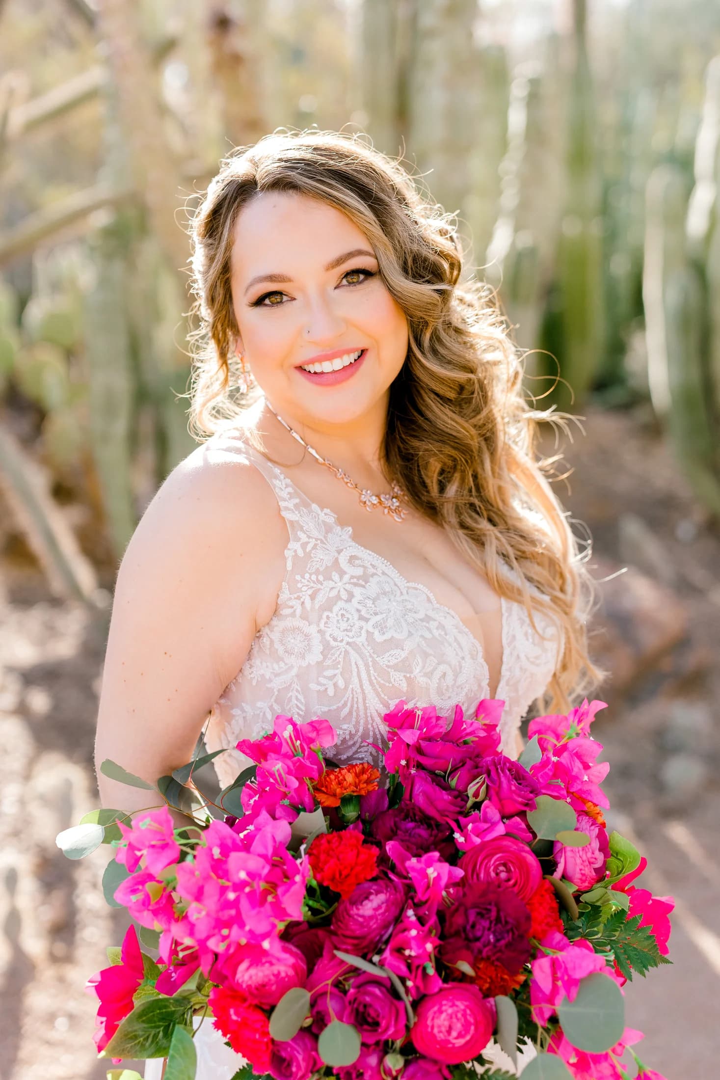 Elena smiling with a colorful bouquet on her wedding day