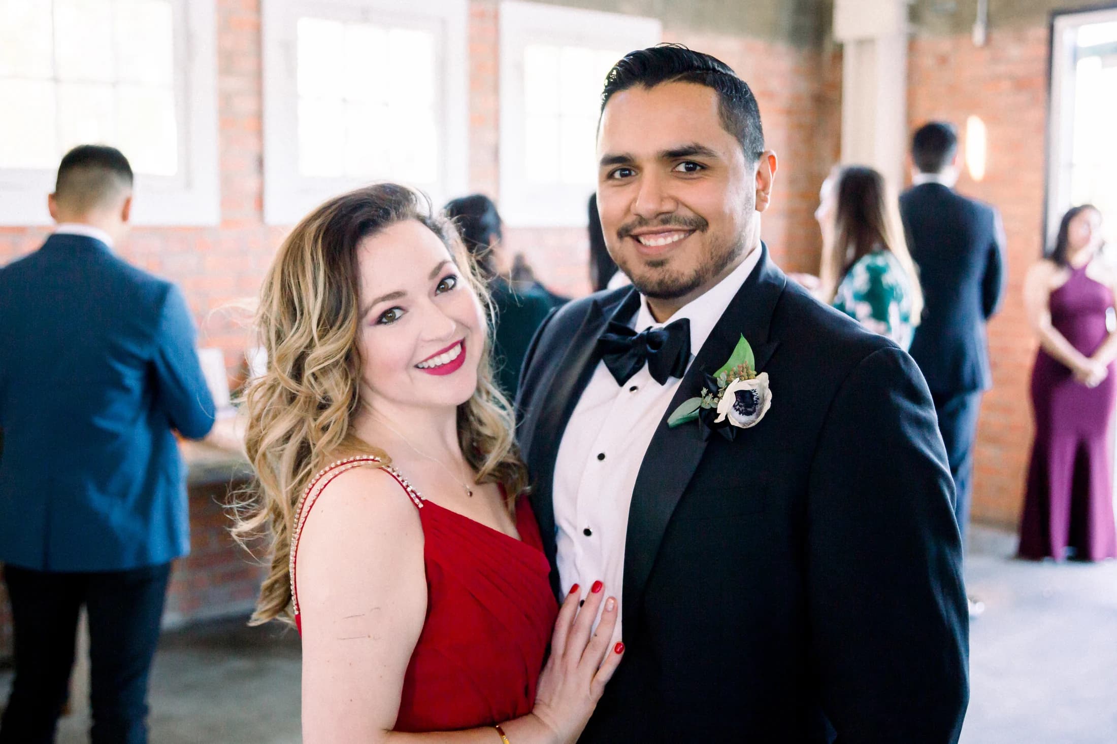 Vincent and Elena dressed up together at a wedding