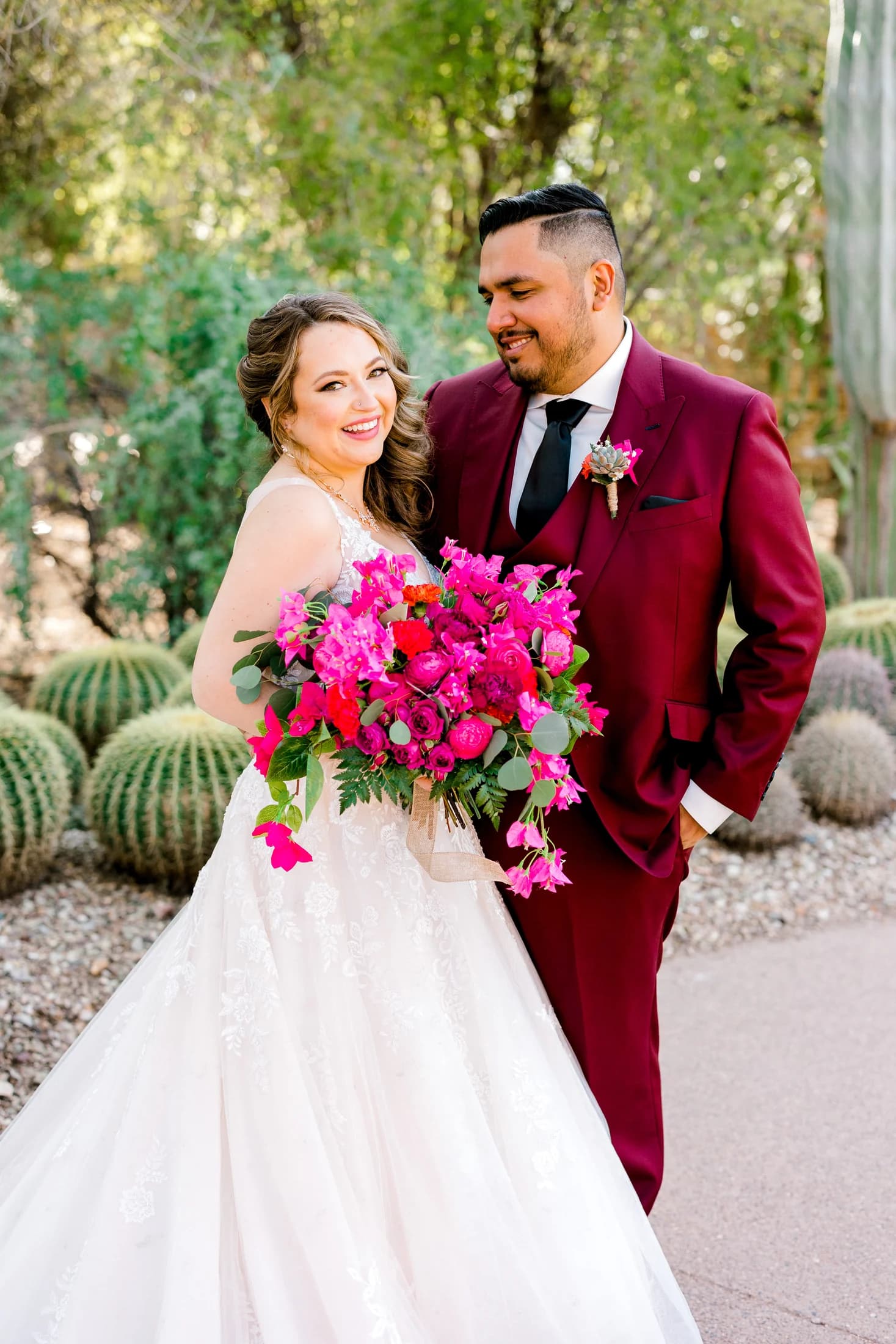 Elena and Vincent smiling at each other on their wedding day