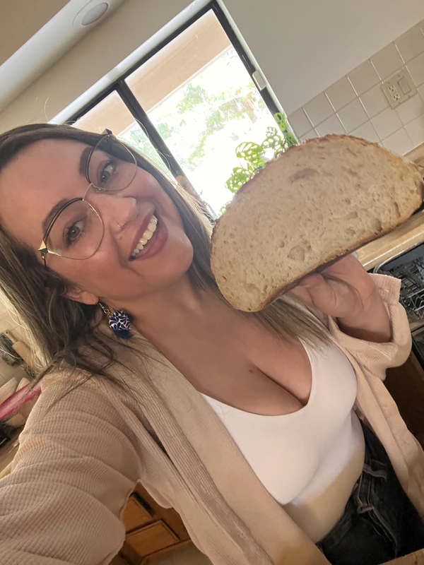 Elena with a slice of homemade bread
